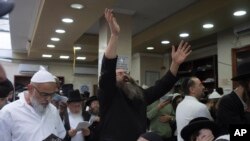 Orthodox Jews pray at the tomb of Rabbi Nachman, the great grandson of the founder of Hasidic movement, in the town of Uman, 200 kilometers (125 miles) south of Ukraine's capital Kiev, Ukraine, Sunday, Sept. 25, 2022. 