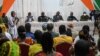 FILE - Ivory Coast's Minister of defense Tene Birahima Ouattara (3rd), Ivorian Army chief of staff, general Lassina Doumbia (4thL) and Generals address the relatives of the 49 Ivorian soldiers detained in Mali, in Abidjan on August 3, 2022. 