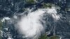 Esta imagen satelital proporcionada por la Administración Nacional Oceánica y Atmosférica muestra a la tormenta tropical Ian sobre el Caribe central el sábado 24 de septiembre de 2022. (NOAA vía AP)