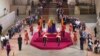 The first members of the public pay their respects as the vigil begins around the coffin of Queen Elizabeth II in Westminster Hall, London, Sept. 14, 2022, where it will lie in state ahead of her funeral on Monday. 