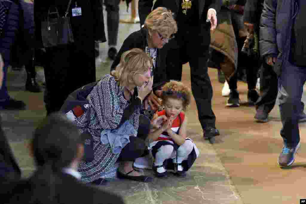 Members of the public pay their respects to Queen Elizabeth II during the lying in State inside Westminster Hall in London, Sept. 18, 2022.