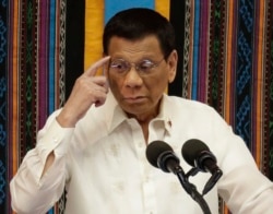 Philippine President Rodrigo Duterte gestures during his 4th State of the Nation Address at the 18th Congress at the House of Representatives in Quezon city, metropolitan Manila, Philippines July 22, 2019. (AP Photo/Aaron Favila)