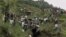 Indians perform rescue work near a wrecked bus that plunged into a deep gorge in Himachal Pradesh state, about 620 kilometers (385 miles) north of New Delhi, India, August 11, 2012.