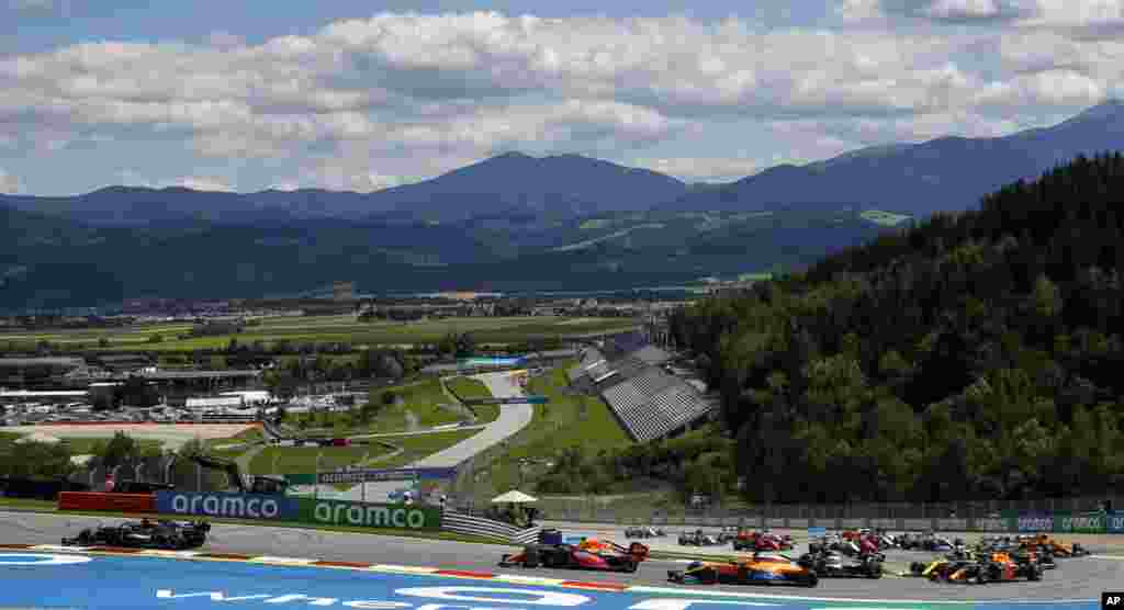 Mercedes driver Lewis Hamilton of Britain, left, leads during the Styrian Formula One Grand Prix race at the Red Bull Ring racetrack in Spielberg, Austria.