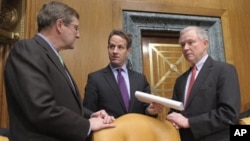 Treasury Secretary Timothy Geithner, center, talks with Senate Budget Committee Chairman Sen. Kent Conrad, D-N.D., left, and the committee's ranking Republican Sen. Jeff Sessions, R-Ala., on Capitol Hill in Washington, Thursday, Feb. 17, 2011.