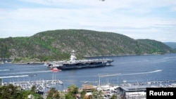 The U.S. aircraft carrier USS Gerald R. Ford on its way into the Oslo Fjord, at Drobak, Moss, Norway, May 24, 2023. (Stian Lysberg Solum/NTB/via REUTERS )
