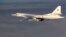 FILE - In this photo made from video taken from Russian Defense Ministry official website on Friday, Nov. 20, 2015, a Russian air force Tu-160 bomber flies a combat mission as part of a Russian air campaign against targets in Syria.