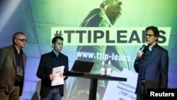 Juergen Knirsch (L-R), Volker Gassner and Stefan Krug of the environmental campaign group Greenpeace address a news conference as they present a copy of the leaked TTIP negotiations in Berlin, Germany, May 2, 2016. 