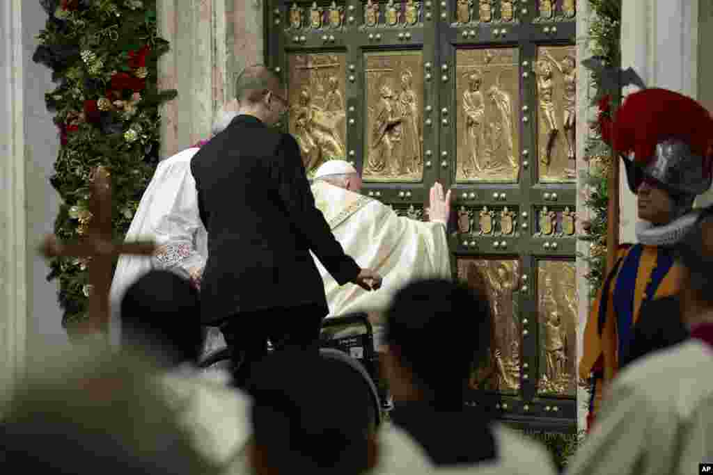 Pope Francis opens the Holy Door to mark the opening of the 2025 Catholic Holy Year, or Jubilee, in St. Peter&#39;s Basilica at the Vatican.