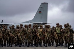 Members of the Kenya Defence Forces (KDF) line up as they prepare to deploy to Goma in eastern Congo as part of the East African Community Regional Force (EACRF), at a military airport in Nairobi, Kenya, Nov. 16, 2022.