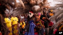 Gule Wamkulu dance secretive society members in gory masks and colorful outfits perform their ritual dance in Harare, Zimbabwe, Oct. 23, 2022.