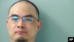 FILE - This photo provided by the Butler County, Ohio, jail shows Xu Yanjun. Xu, a Chinese national convicted of trying to steal trade secrets from U.S. aviation and aerospace companies, has been sentenced to 20 years in prison.
