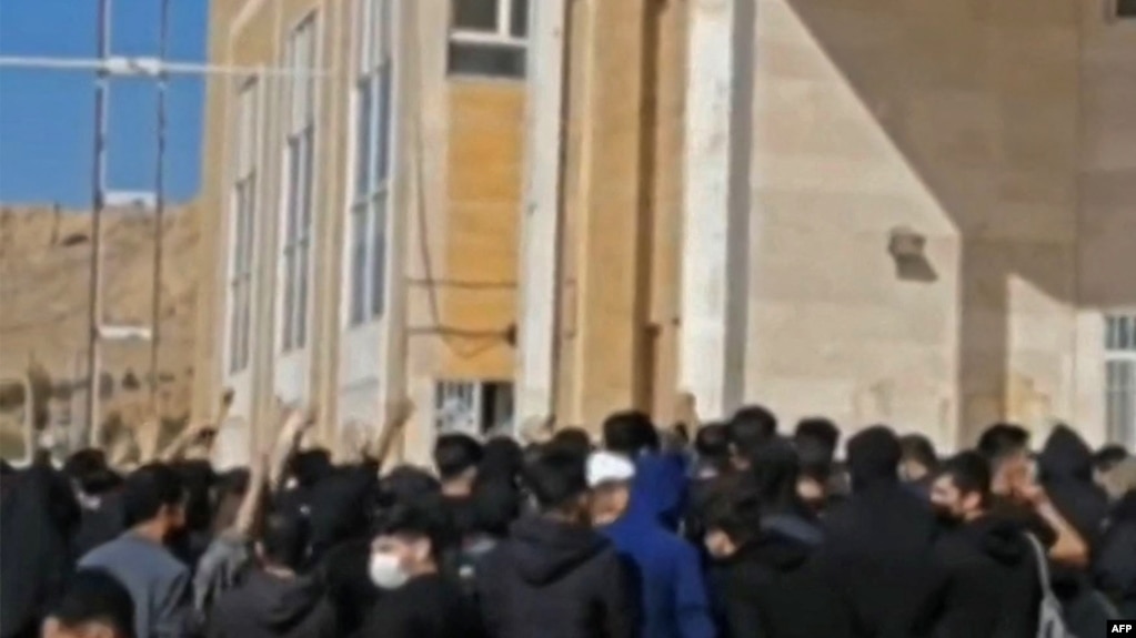This grab taken from a UGC video made available on the ESN platform on Nov. 15, 2022, reportedely shows Iranian students chanting slogans at the Kermanshah university in support of the protest movement in western Iran's city of Kermanshah.