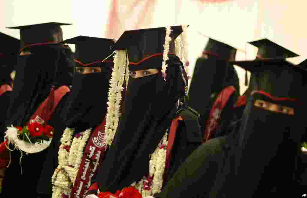 Yemeni female university students celebrate during their graduation ceremony in Sana'a, April 28, 2014.