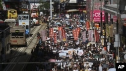 Marches in Hong Kong on Sunday, July 29, 2012 protest Beijing-approved "national education" plans.