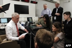 Defense Secretary Jim Mattis speaks to reporters aboard a US military plane on May 29, 2018, as he flies to Hawaii.