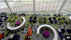 Students work in the Rain Garden Reading Lounge inside the Hunt Library at North Carolina State University in Raleigh, N.C., May 3, 2016.