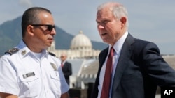 U.S. Attorney General Jeff Sessions speaks with Howard Augusto Cotto Castaneda, Director General of the National Police as they look over the city from the roof during a visit to the National Police Headquarters in San Salvador, El Salvador, July 28, 2017
