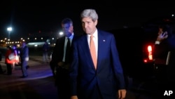 U.S. Secretary of State John Kerry is seen by his plane in Tel Aviv, Israel, Wednesday, July 23, 2014, engaged in shuttle diplomacy on the Gaza conflict.