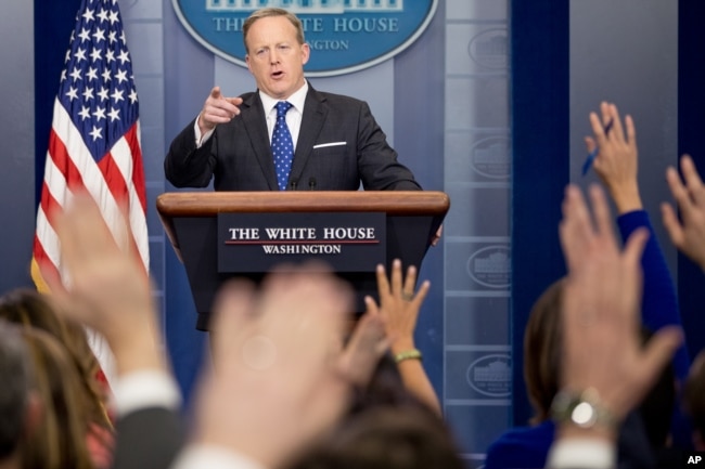 FILE - White House press secretary Sean Spicer takes a question from a member of the media during the daily press briefing at the White House in Washington, Feb. 21, 2017.