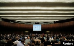 FILE - A slide is pictured during a briefing for World Health Assembly delegates on the Ebola outbreak response in Democratic Republic of the Congo at the United Nations in Geneva, May 23, 2018.