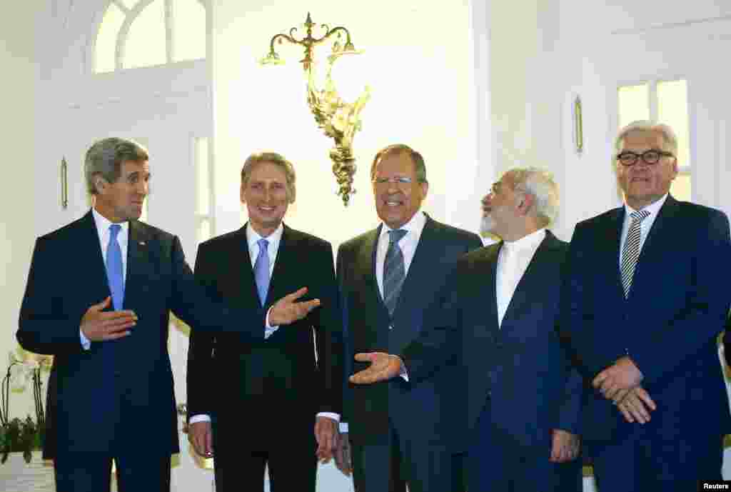 U.S. Secretary of State John Kerry, Britain's Foreign Secretary Philip Hammond, Russian Foreign Minister Sergei Lavrov, Iranian Foreign Minister Javad Zarif and German Foreign Minister Frank-Walter Steinmeier pose for photographers before a meeting in Vienna, Nov. 24, 2014.
