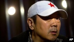 Veteran Chinese rock star Cui Jian pauses while speaking during an interview in Beijing, Dec. 29, 2015. China’s Godfather of rock Cui said his message of personal freedom hasn’t changed in his new album, even if the world has. 