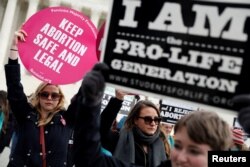 Pro-life and pro-choice activists gather at the Supreme Court for the National March for Life rally in Washington, D.C., Jan. 27, 2017.