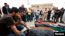 Mourners gather for funeral prayers for fighters killed by warplanes of Field Marshal Khalifa Hifter's forces, April 24, 2019 in Tripoli, Libya.