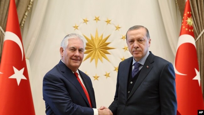 U.S. Secretary of State Rex Tillerson (left) poses with Turkey's President Recep Tayyip Erdogan before their meeting in Ankara, Turkey, March 30, 2017.