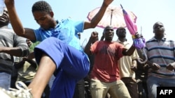 Striking mine workers protest outside the Anglo American Mine in Rustenburg, South Africa, October 5, 2012.