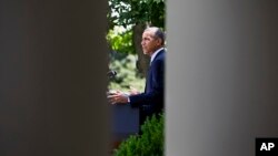 President Barack Obama makes a statement about immigration reform, in the Rose Garden of the White House in Washington, June 30, 2014.