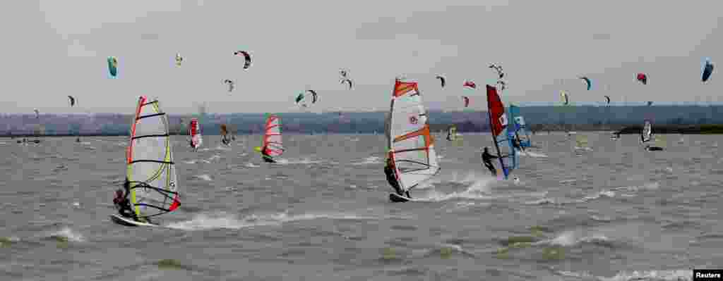 Wind and kitesurfers enjoy a windy day on lake Neusiedl in Podersdorf, Austria, July 2 ,2017.