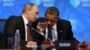 U.S. President Barack Obama (R) listens to Russia's President Vladimir Putin before the opening of the first plenary session of the G-20 Summit in Los Cabos, Mexico, June 18, 2012.