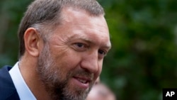 FILE - Russian metals magnate Oleg Deripaska attends Independence Day celebrations at Spaso House, the residence of the American Ambassador, in Moscow, Russia, July 2, 2015.