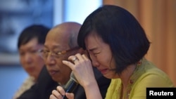 Veronica Tan, the wife of Jakarta's former governor, Basuki Tjahaja Purnama, popularly known as "Ahok," weeps during a news conference in Jakarta, May 23, 2017 in this photo taken by Antara Foto.