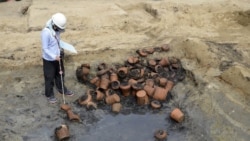 This undated photo provided Wednesday, Aug. 26, 2020, by Osaka City Cultural Properties Association, shows urns found at the "Umeda Grave" burial site, in Osaka, western Japan. (Osaka City Cultural Properties Association via AP)