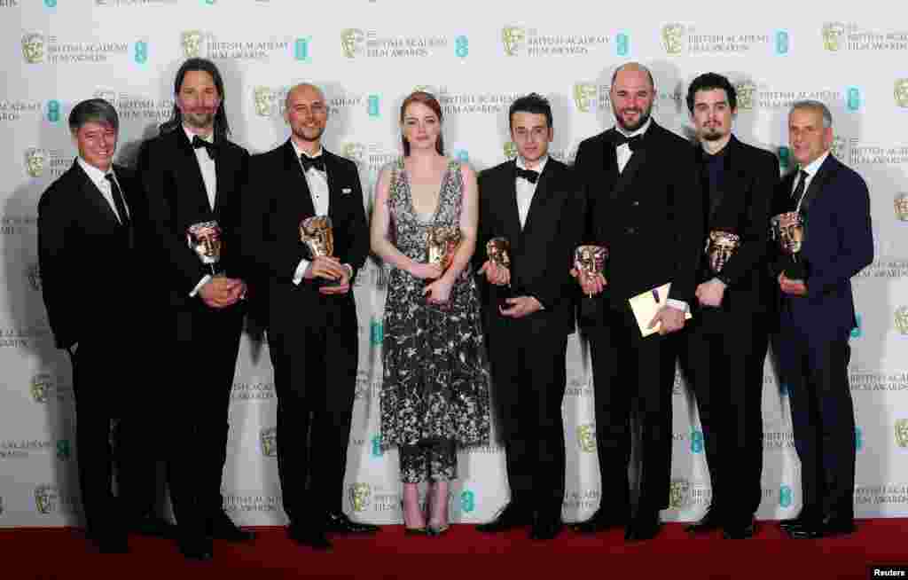 The team behind &#39;La La Land&quot; hold their awards for Best Film at the British Academy of Film and Television Awards (BAFTA) at the Royal Albert Hall in London, Britain, Feb.ruary 12, 2017.