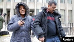 Santhanaladchumy Kanagaratnam, mother of Kirushna Kumar Kanagaratnam who was killed by Bruce McArthur, is led from court after McArthur was sentenced to life in prison following his guilty plea to eight counts of first-degree murder, in Toronto, Feb. 8, 2019.