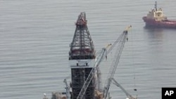 FILE - In a Tuesday, June 8, 2010 photo, a deepwater drilling rig operates near the site of the Deepwater Horizon disaster in the Gulf of Mexico