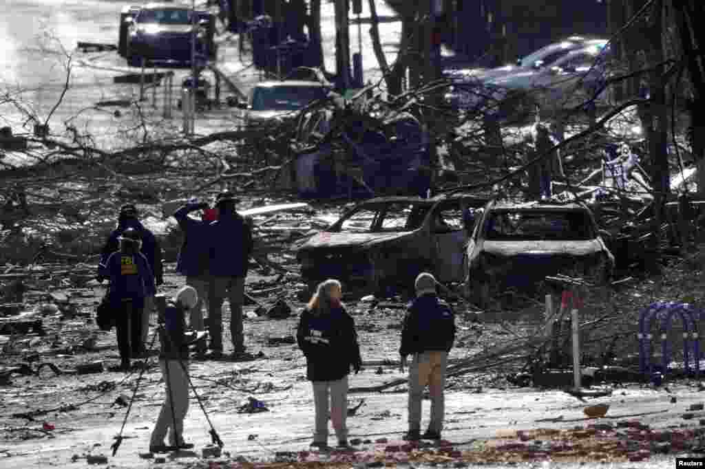 Investigators work at the site of an explosion on 2nd Avenue in Nashville, Tennessee, Dec. 26, 2020.