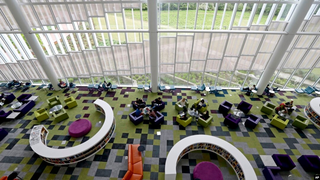 Students work in the Rain Garden Reading Lounge inside the Hunt Library at North Carolina State University in Raleigh, N.C., May 3, 2016.