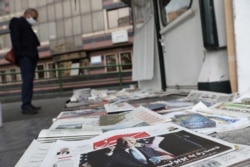 FILE - A newspaper with a front picture of U.S. President-elect Joe Biden is seen at a newsstand in Tehran, Iran, Nov. 8, 2020.