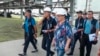 In this handout photo taken from video released by Russian Defense Ministry Press Service on Sept. 2, 2022, International Atomic Energy Agency (IAEA) director Rafael Grossi, center, and IAEA members walk while inspecting the Zaporizhzhia nuclear power pla