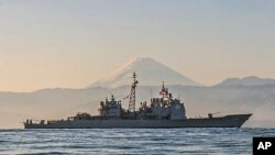 FILE- USS Antietam (CG 54) off the coast of Japan. Antietam is a Ticonderoga-class guided-missile cruiser on patrol in the 7th Fleet area of the Indo-Asia-Pacific region, Nov. 22, 2014