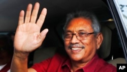 FILE- Sri Lanka's president-elect Gotabaya Rajapaksa waves to supporters as he leaves the election commission after the announcement of his victory in Colombo, Sri Lanka, Nov. 17, 2019. 