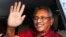 FILE- Sri Lanka's president-elect Gotabaya Rajapaksa waves to supporters as he leaves the election commission after the announcement of his victory in Colombo, Sri Lanka, Nov. 17, 2019. 