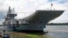 Indian Navy officers stand on the flight deck of India's first home-built aircraft carrier INS Vikrant after its commissioning ceremony at a state-run shipyard in Kochi, India, Sept. 2, 2022.