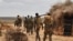 FILE - A handout photo taken June 10, 2016, and released by the African Union Mission in Somalia, shows soldiers in a village in Somalia's Hiran region. Somalia's military said Sept. 20, 2022, it had liberated the town of Booco from more than a decade of control by al-Shabab. 
