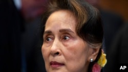 FILE - Myanmar's leader Aung San Suu Kyi waits to address judges of the International Court of Justice in The Hague, Netherlands, Dec. 11, 2019.